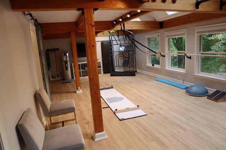 Movement and assessment space with mats and open floor