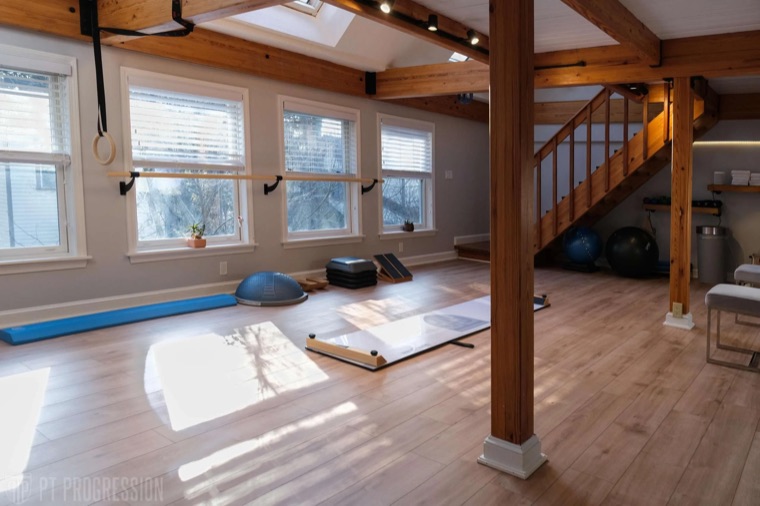 Upper-level training room bathed in daylight